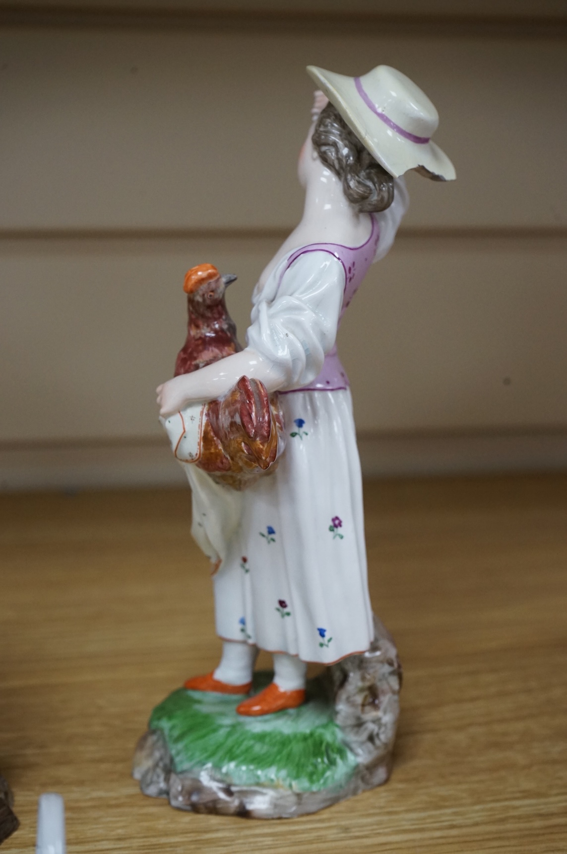 A pair of 19th century Hochst Damm faience figures and a Meissen twin section salt, tallest figure 20cm